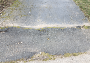 worn down asphalt driveway problems solved by concrete driveways